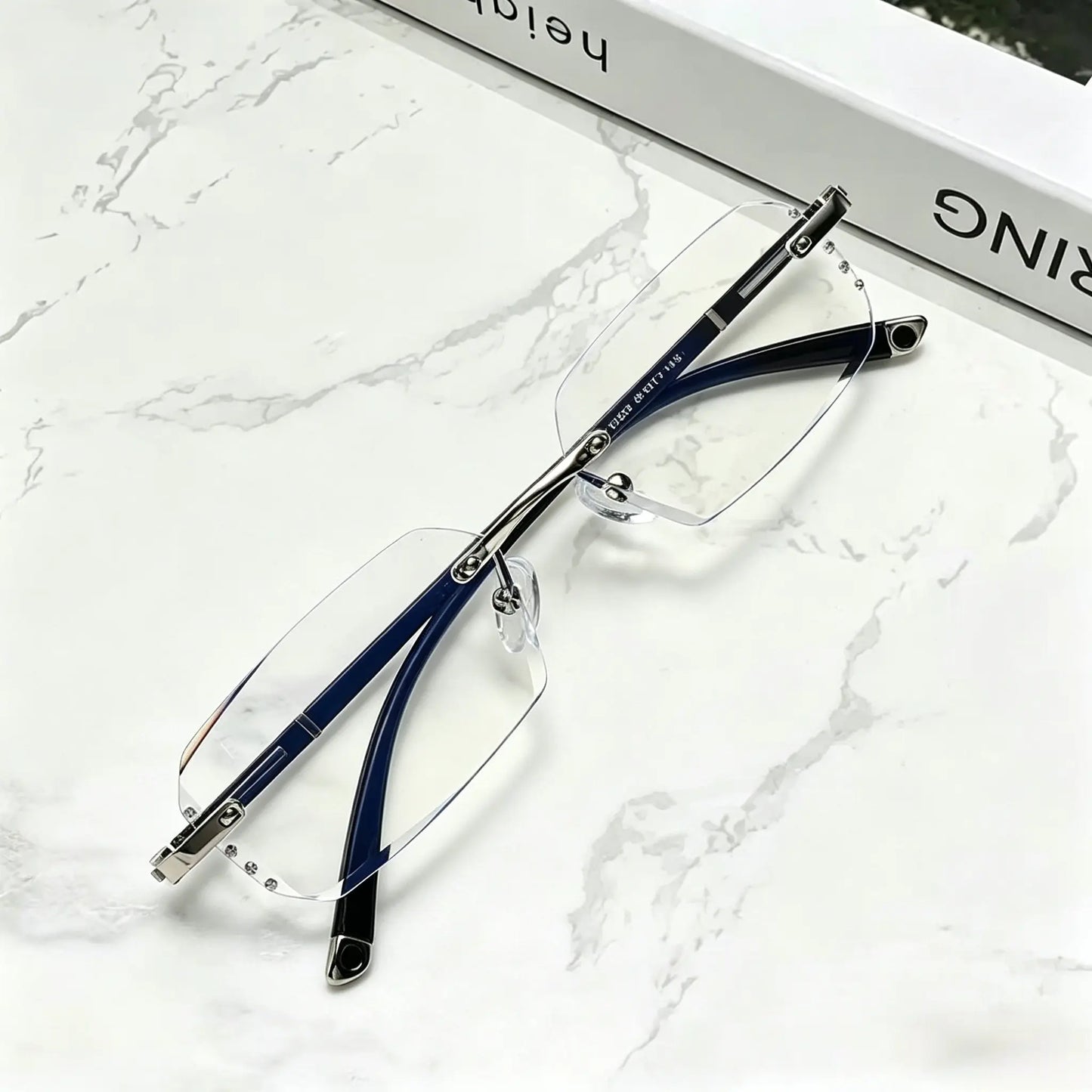 Diamond Edge Frameless Glasses – Blue Light Blocking Clear Readers for Men & Women. Lightweight Metal Temple Decor, Ideal for Gaming, Office, or Street Style.
